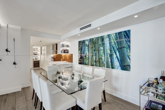1121 Crandon Blvd Unit D706, Key Biscayne, FL 33149 - dining space featuring light wood-style floors, visible vents, and baseboards
