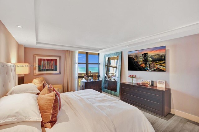 1121 Crandon Blvd Unit D706, Key Biscayne, FL 33149 - bedroom with baseboards and wood finished floors
