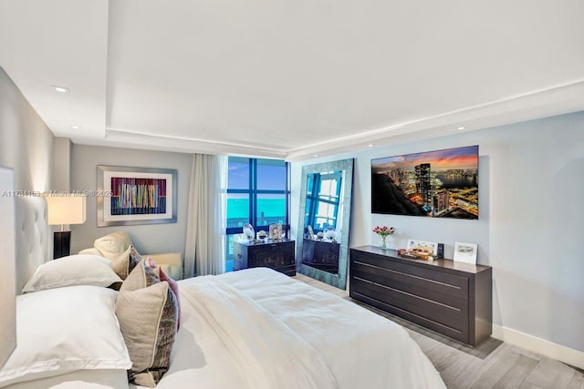 1121 Crandon Blvd Unit D706, Key Biscayne, FL 33149 - bedroom featuring baseboards and wood finished floors