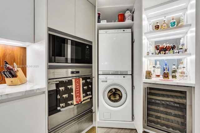 1121 Crandon Blvd Unit D706, Key Biscayne, FL 33149 - laundry room with stacked washer / dryer, beverage cooler, and a bar