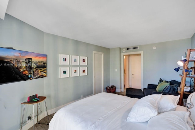 bedroom with wood-type flooring