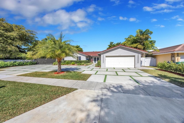 ranch-style home with a garage and a front lawn