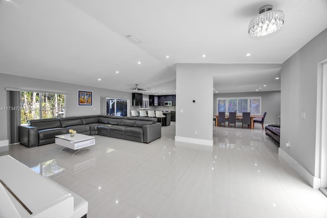 tiled living room with lofted ceiling