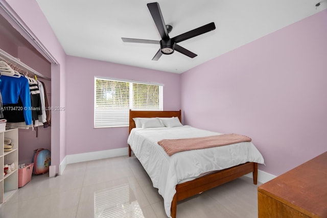 tiled bedroom with a closet and ceiling fan