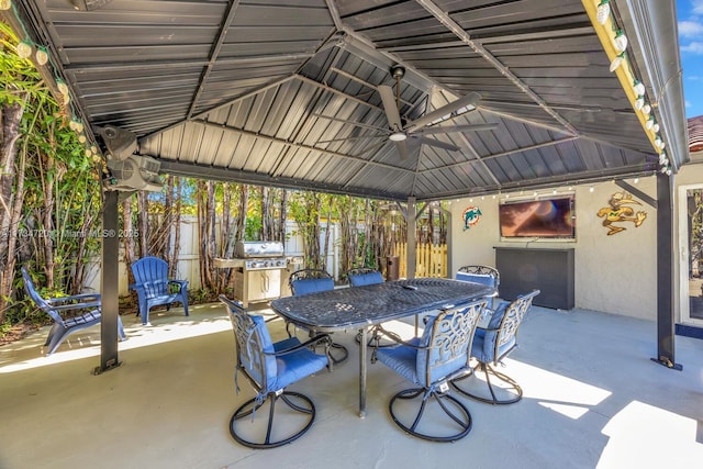 view of patio featuring a gazebo, area for grilling, and ceiling fan