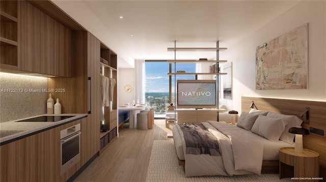 bedroom featuring light hardwood / wood-style flooring and expansive windows