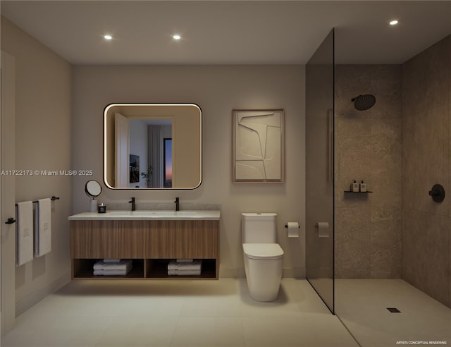 bathroom featuring a tile shower, vanity, and toilet