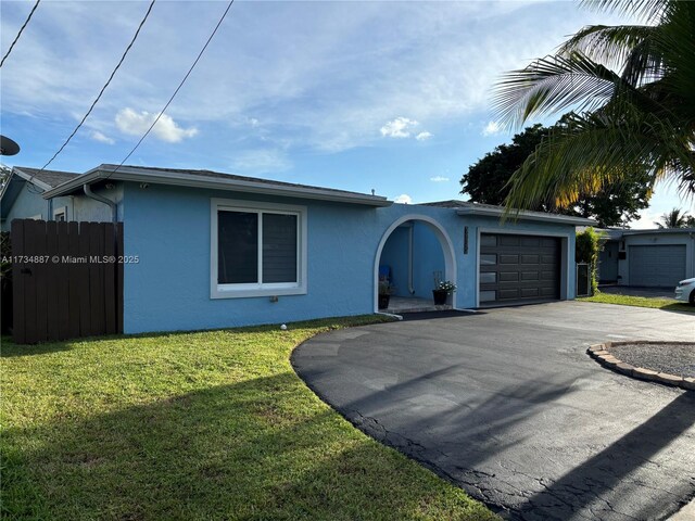 view of front facade featuring a garage and a front yard