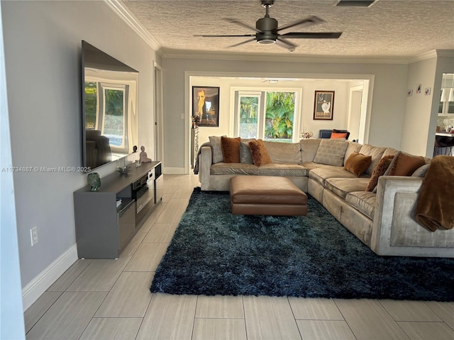 living room featuring ceiling fan, crown molding, and a textured ceiling