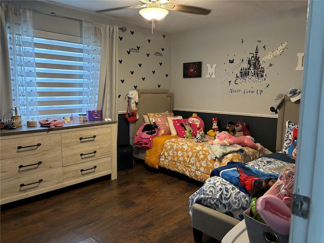 bedroom with dark wood-type flooring and ceiling fan