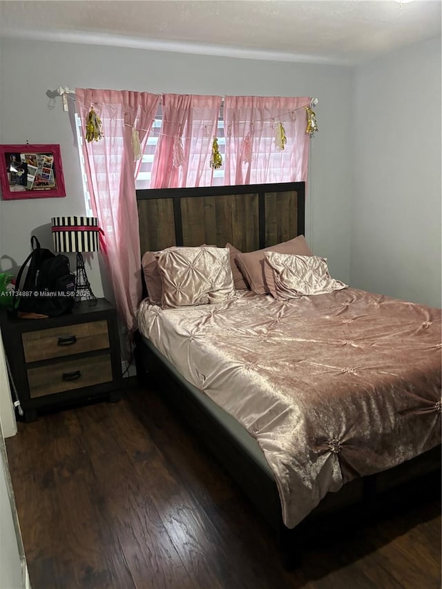 bedroom featuring dark hardwood / wood-style floors