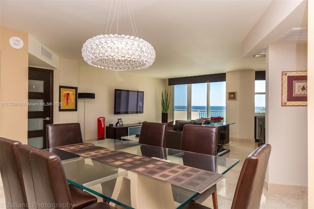 dining area with a chandelier