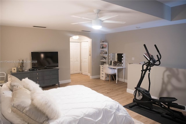 bedroom with ceiling fan and light wood-type flooring