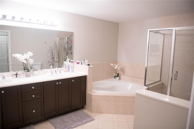 bathroom with vanity, tile patterned floors, and separate shower and tub