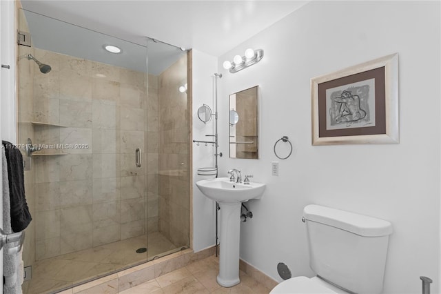 bathroom featuring an enclosed shower, tile patterned flooring, and toilet