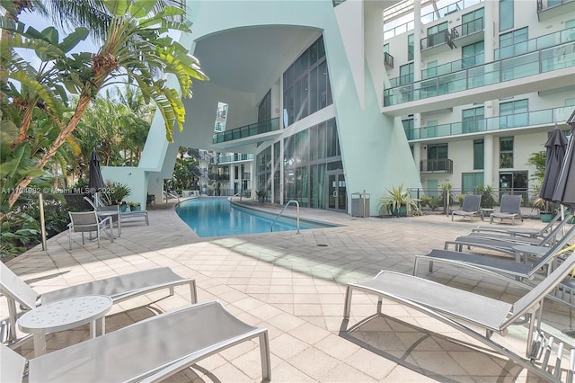 view of pool featuring a patio area