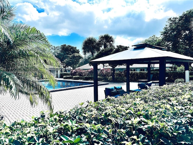 view of swimming pool featuring a gazebo