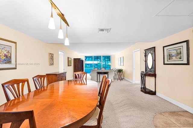 view of carpeted dining space