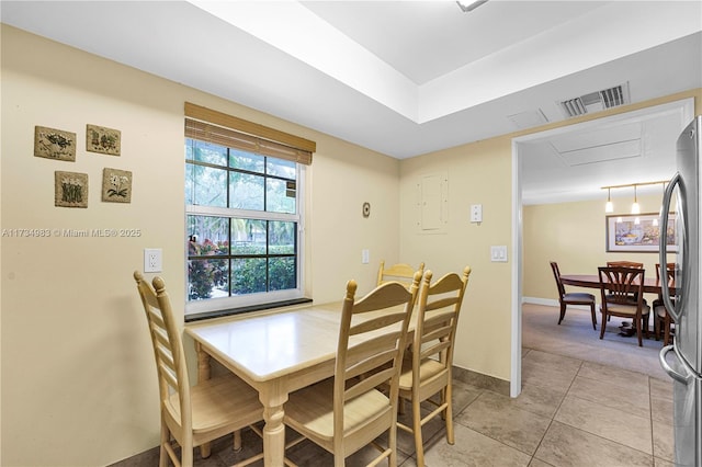 dining room featuring light tile patterned flooring