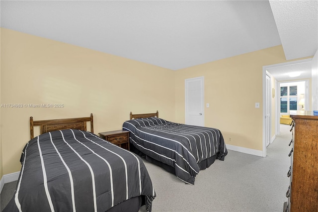 carpeted bedroom with a textured ceiling