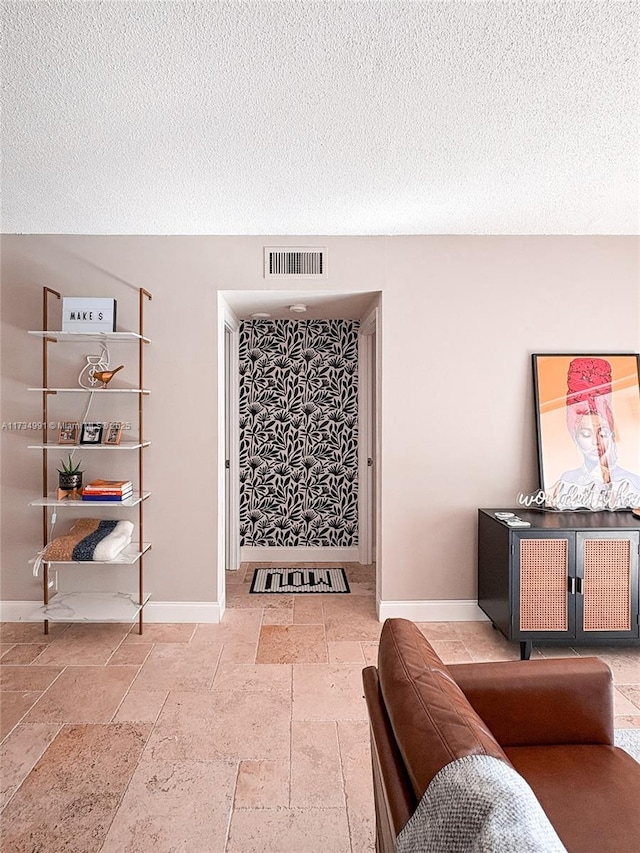 living room featuring a textured ceiling