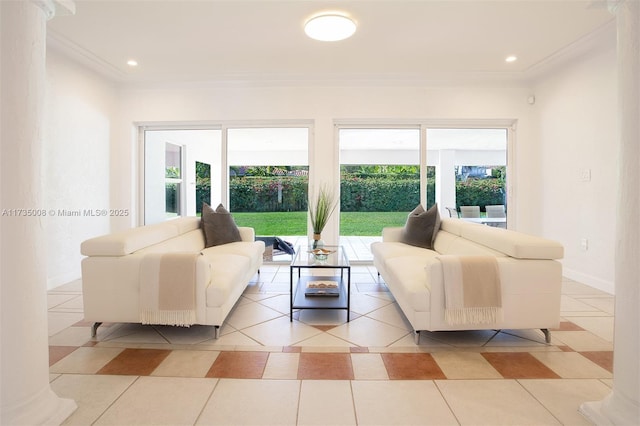 tiled living room featuring plenty of natural light and ornamental molding