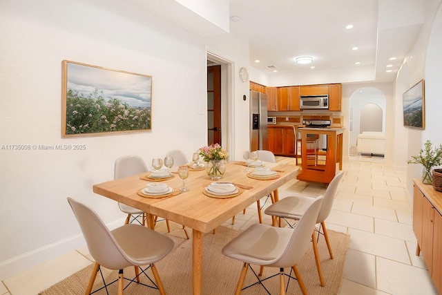 dining area with light tile patterned flooring