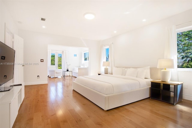 bedroom with light hardwood / wood-style floors