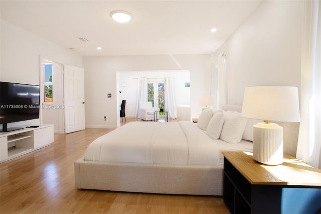 bedroom with light hardwood / wood-style floors