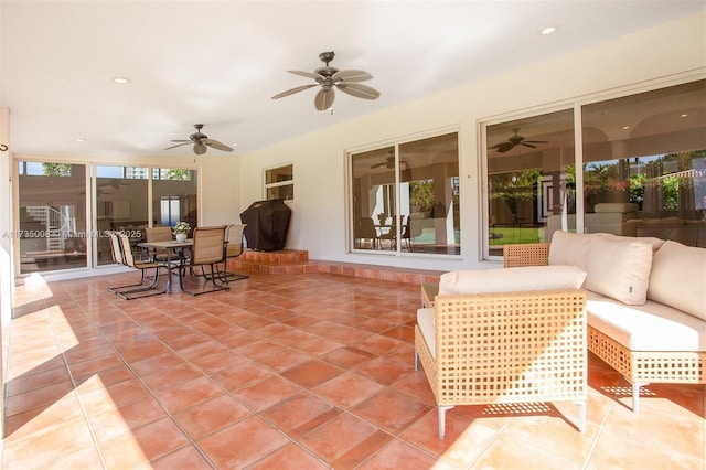 view of patio with an outdoor living space and ceiling fan