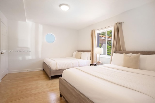 bedroom with light hardwood / wood-style flooring