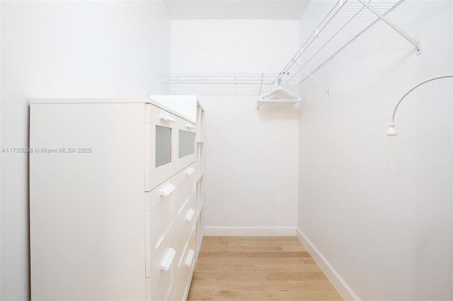 walk in closet featuring light wood-type flooring