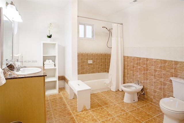 full bathroom with tile patterned floors, toilet, tile walls, vanity, and shower / bath combo