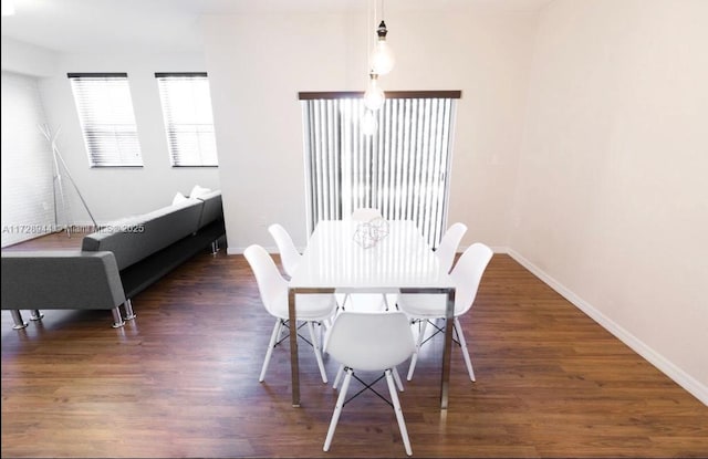 dining room featuring dark hardwood / wood-style flooring