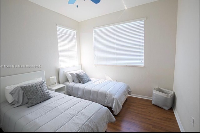 bedroom featuring dark hardwood / wood-style floors and ceiling fan