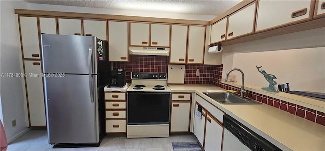 kitchen with under cabinet range hood, white appliances, a sink, light countertops, and backsplash