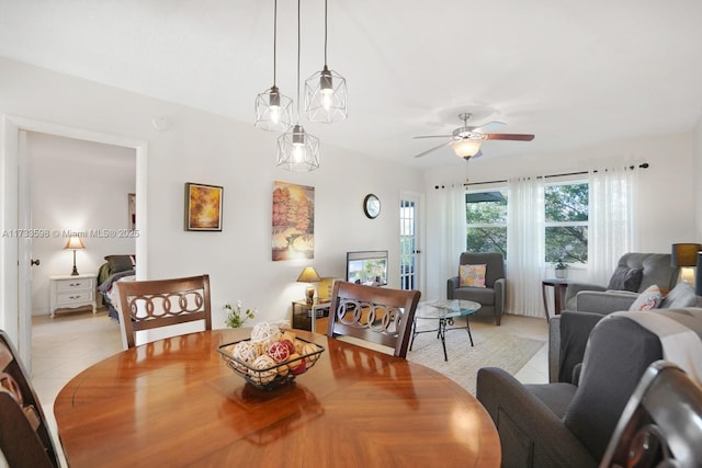 tiled dining area with ceiling fan