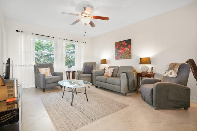 living room with light tile patterned floors and ceiling fan