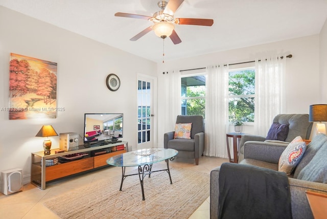 tiled living room with ceiling fan