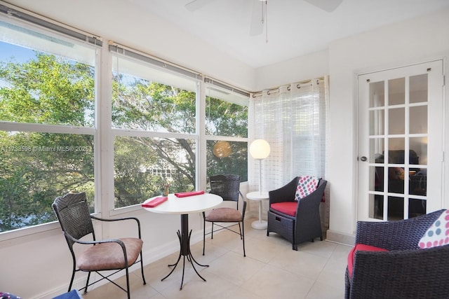 sunroom / solarium featuring ceiling fan and plenty of natural light