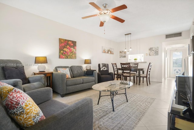 tiled living room featuring ceiling fan