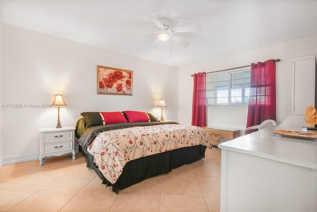 tiled bedroom featuring ceiling fan