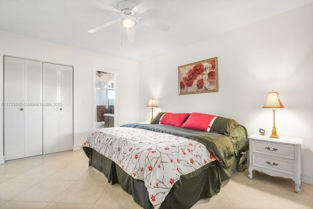 tiled bedroom with ceiling fan, ensuite bathroom, and a closet