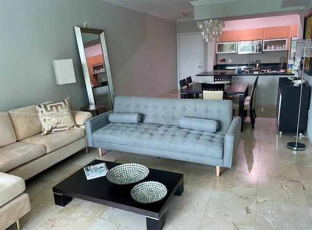 living room featuring ornamental molding and an inviting chandelier