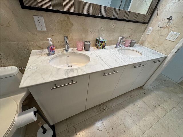 bathroom featuring vanity and toilet