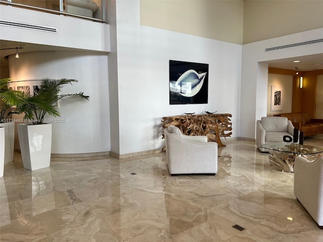 living room with a towering ceiling