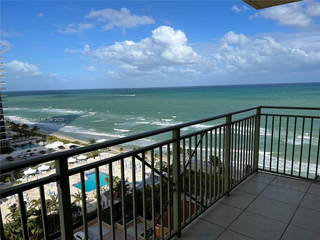 balcony with a view of the beach and a water view