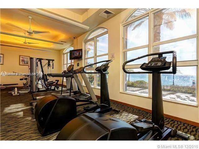 gym featuring carpet floors and ceiling fan