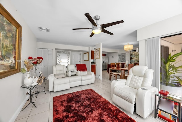 living room with light tile patterned floors and ceiling fan