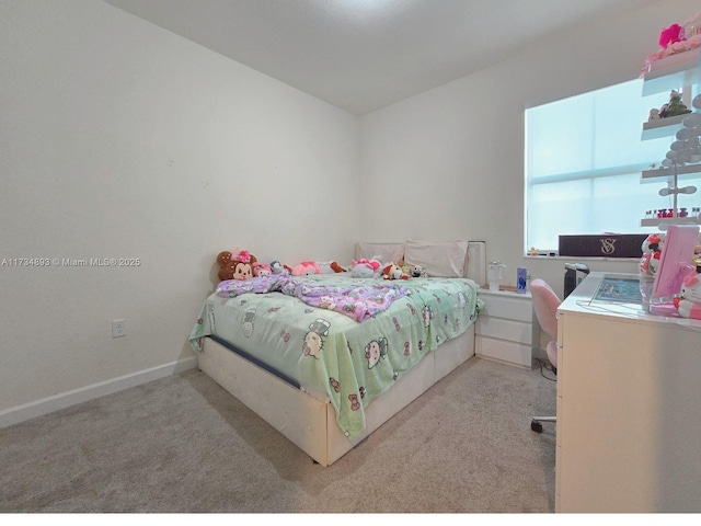 bedroom featuring light colored carpet